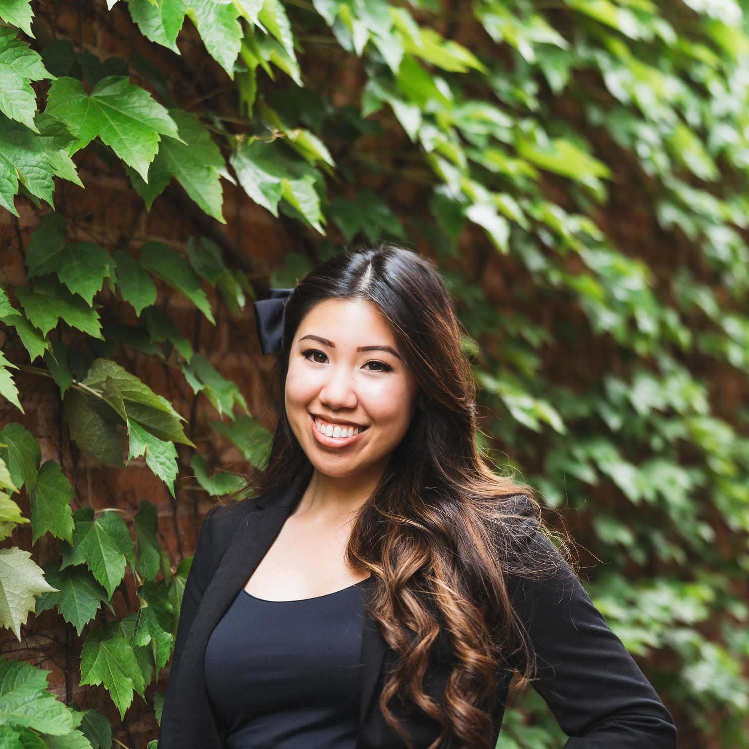 Portrait of Abby, a professional stylist at Anasa Salon, showcasing their expertise and style.