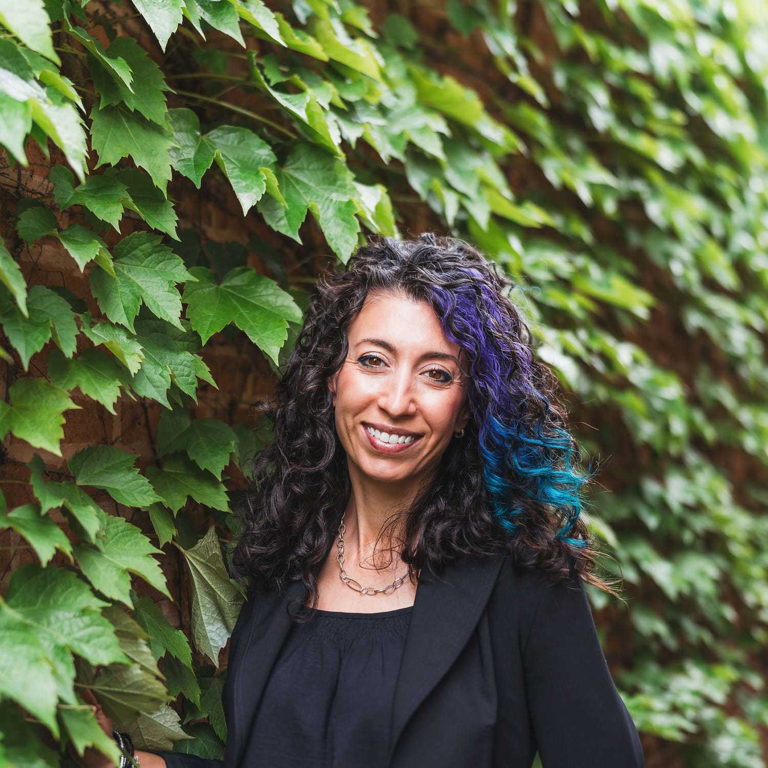 Portrait of Litsa, a professional stylist at Anasa Salon, showcasing their expertise and style.