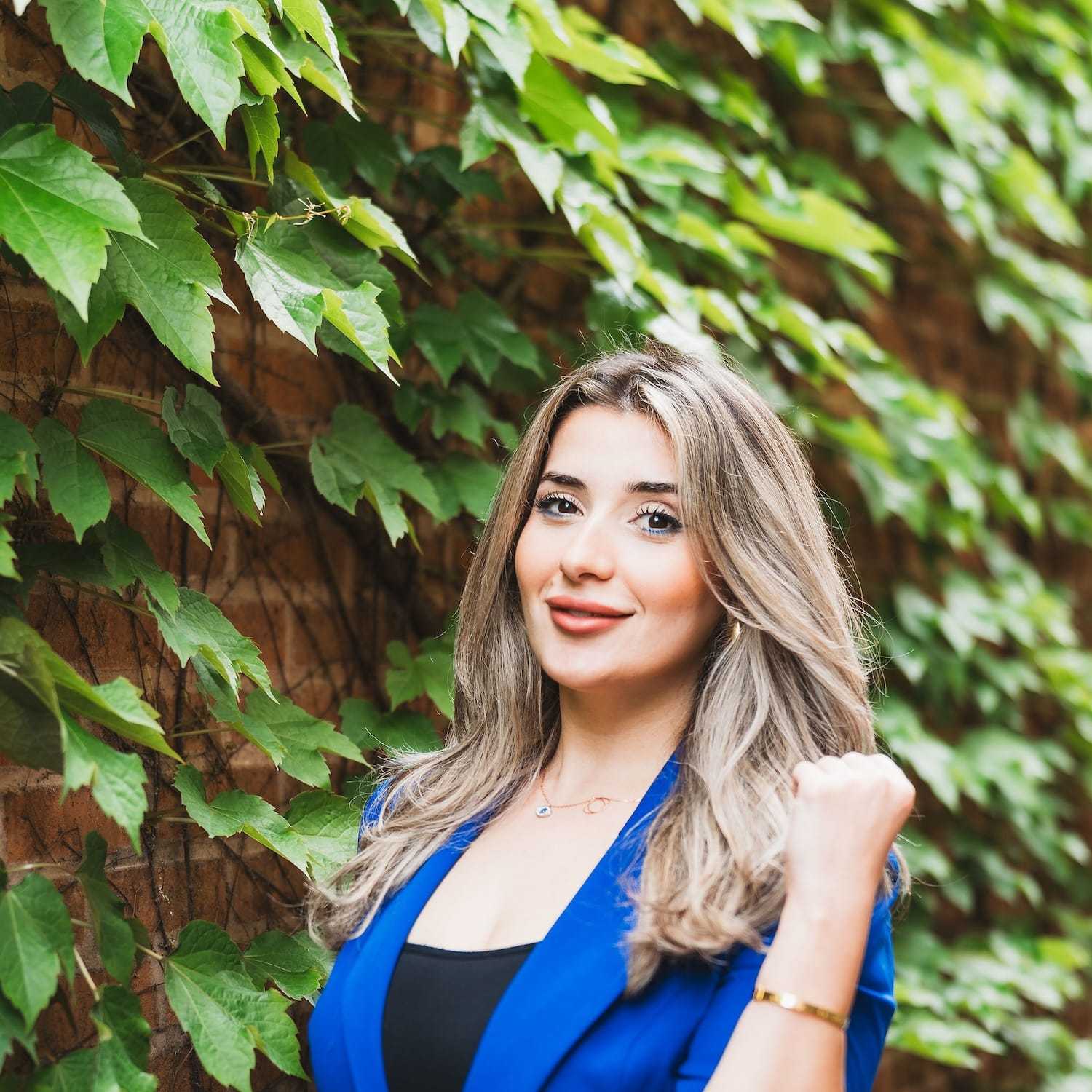 Portrait of Sarah, a professional stylist at Anasa Salon, showcasing their expertise and style.