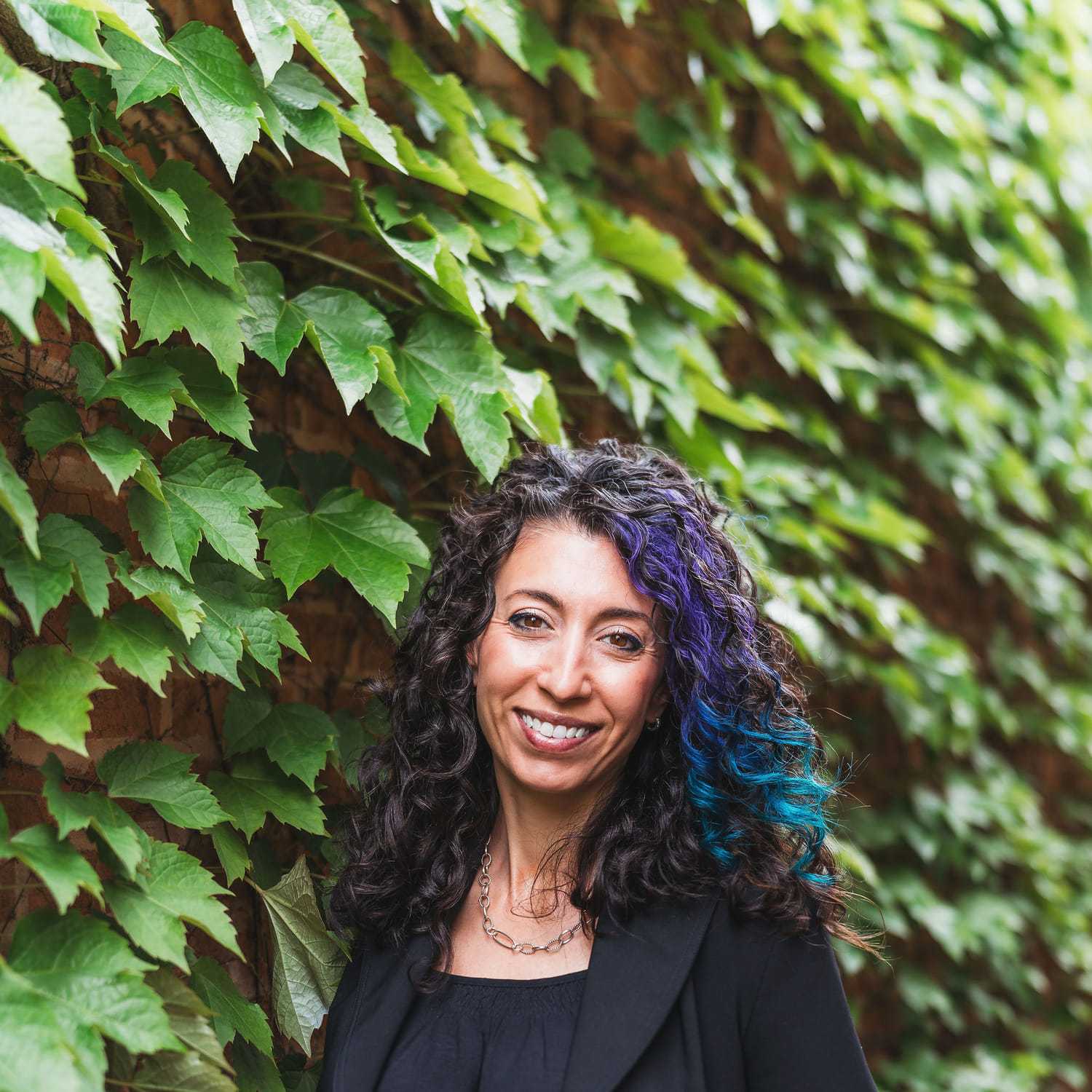 Portrait of Litsa, a professional stylist at Anasa Salon, showcasing their expertise and style.