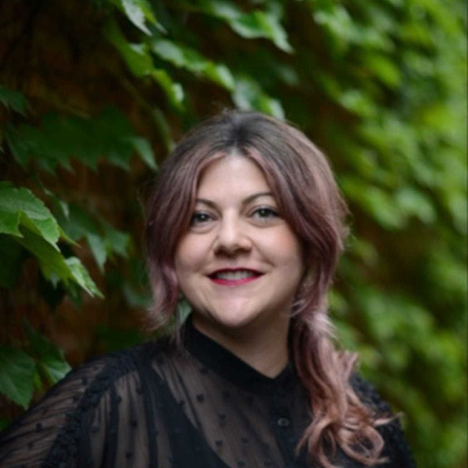 Portrait of Amy, a professional stylist at Anasa Salon, showcasing their expertise and style.