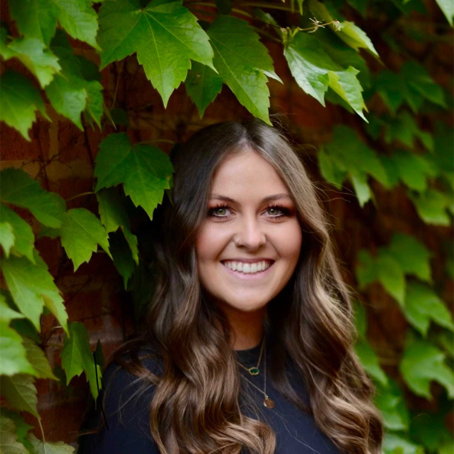 Portrait of Mary, a professional stylist at Anasa Salon, showcasing their expertise and style.