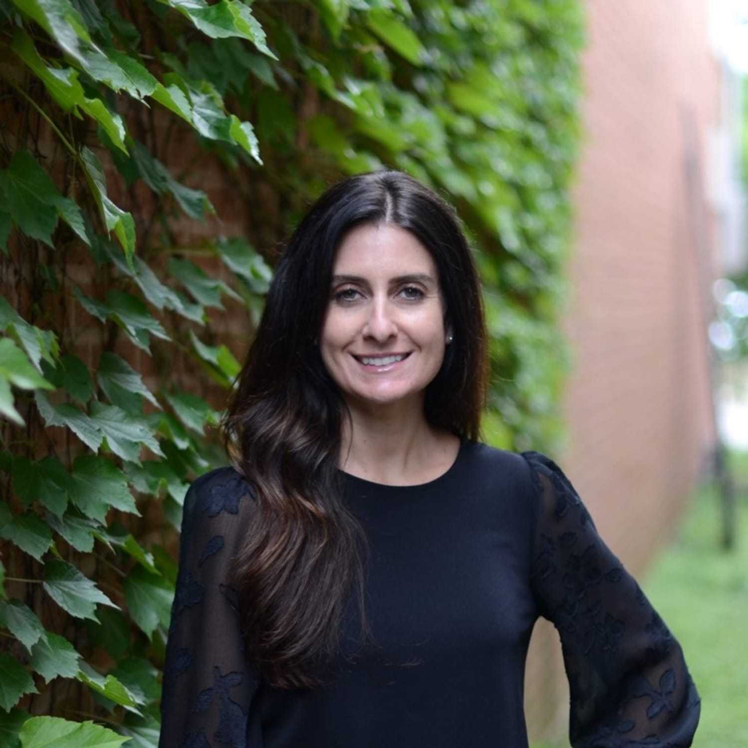 Portrait of Michelle, a professional stylist at Anasa Salon, showcasing their expertise and style.